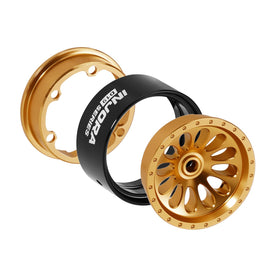 Close-up of teardrop spokes with gold finish enhancing the scale look.