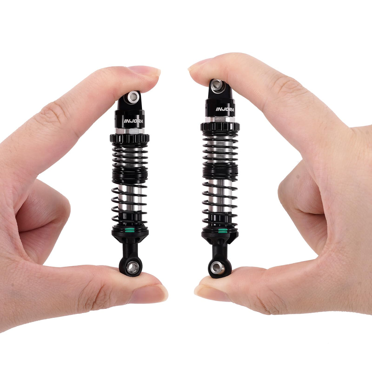 INJORA DRX shocks in packaging ready for setup and installation.