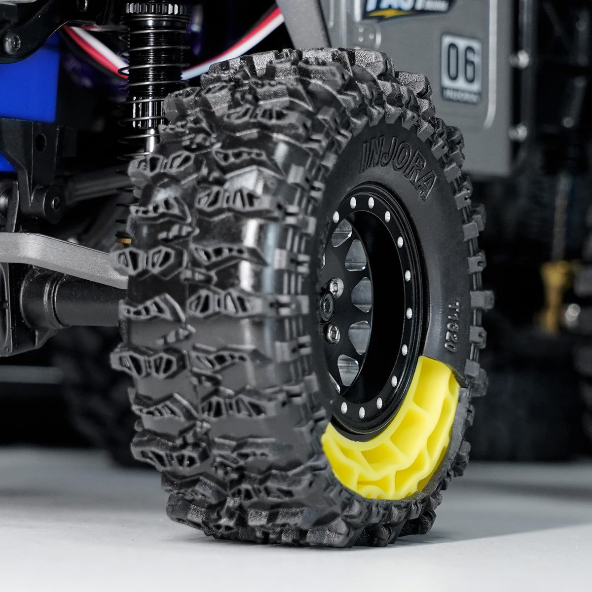 INJORA 1.3 rock crawling wheels with seamless fitment for micro crawlers.
