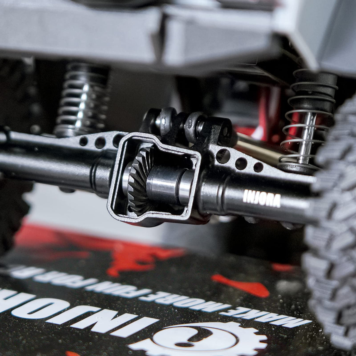 INJORA front-overdrive detail suggests enhanced steering feel on challenging courses.