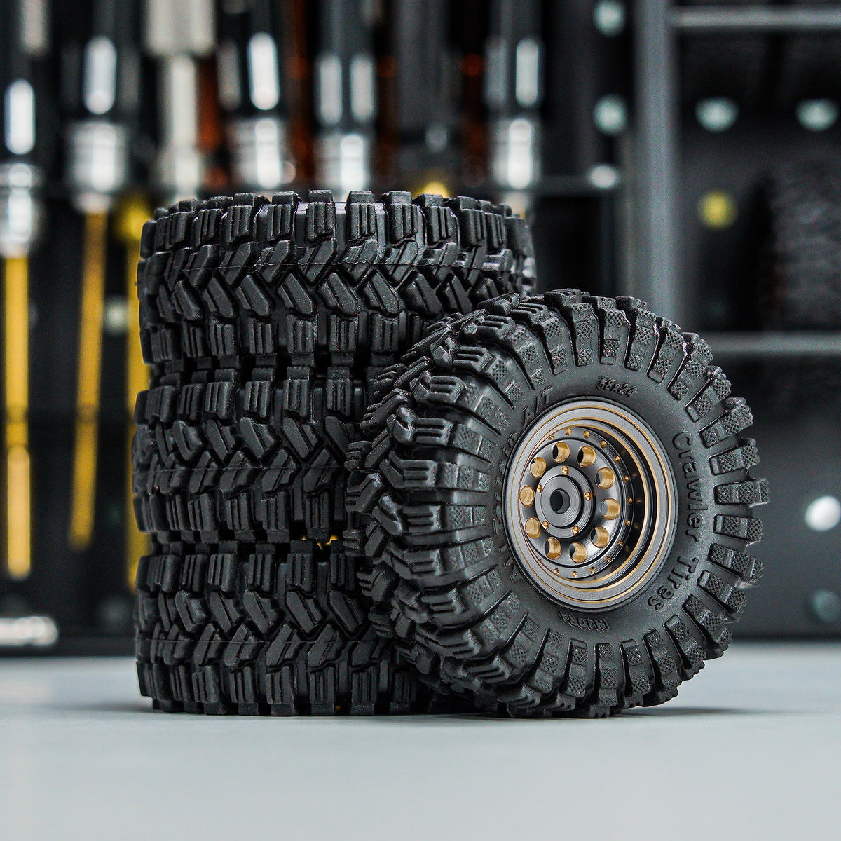 INJORA grey RC crawler set shown on rugged terrain for durable performance.
