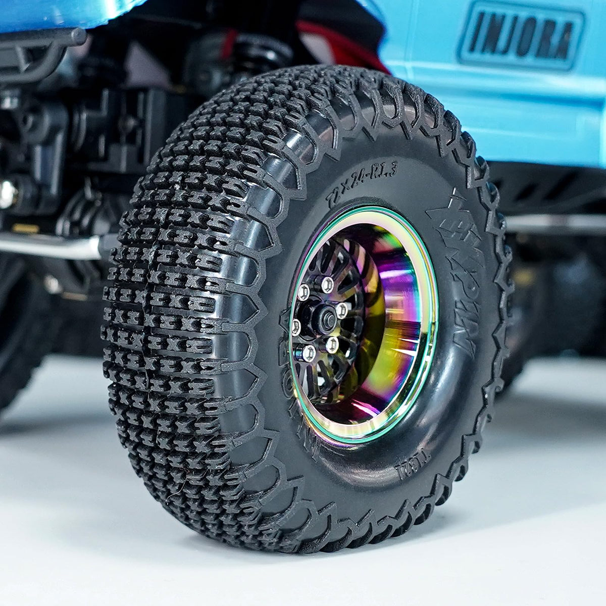 Rainbow finish detail on INJORA ModuWheel for a bold look