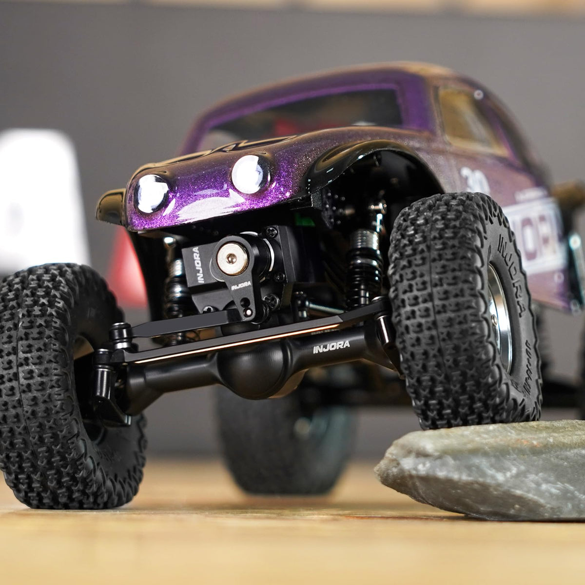 INJORA plus3mm planet axles U-joint front shafts enable smooth articulation.