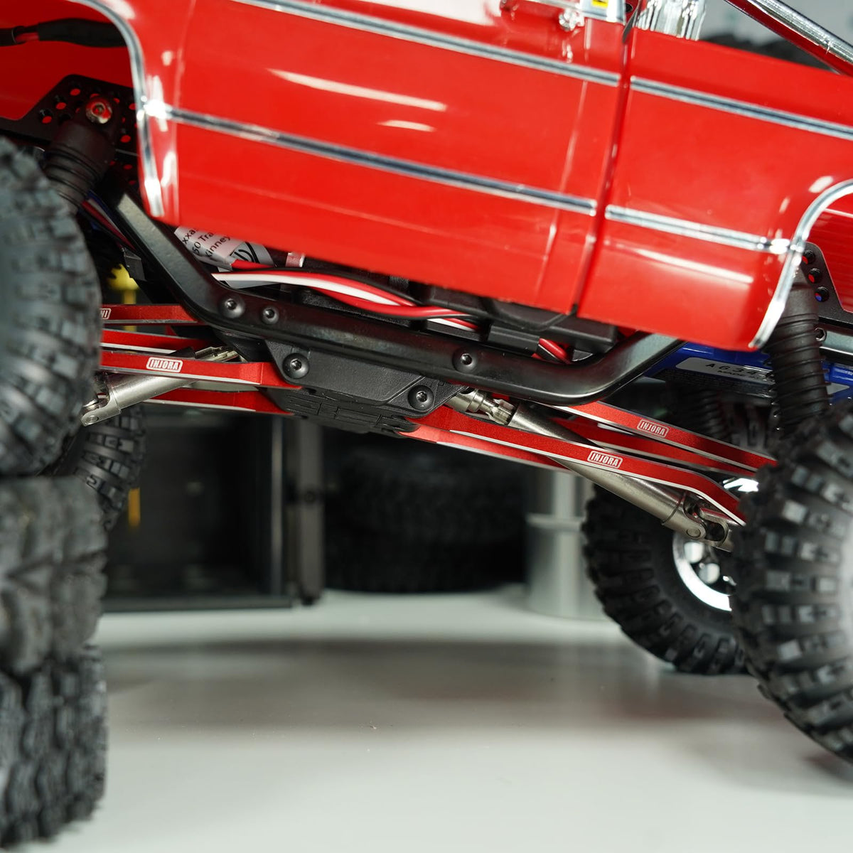 Red chassis link assembly ready for quick crawler upgrades