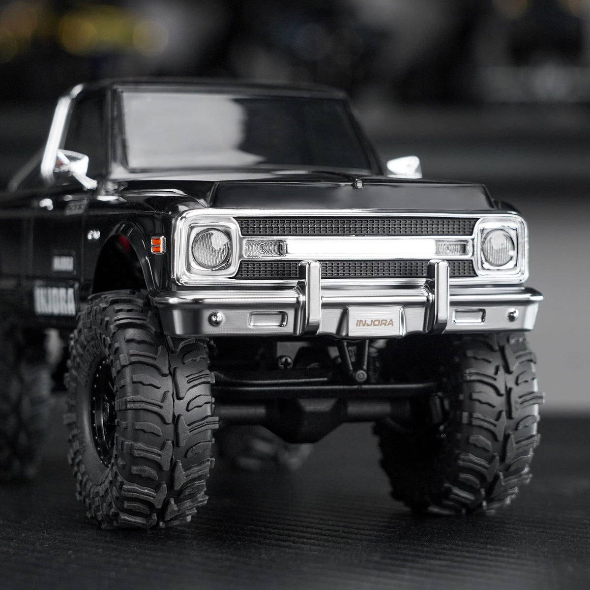 INJORA SCX30 side-view bumper chrome on the K10 chassis.