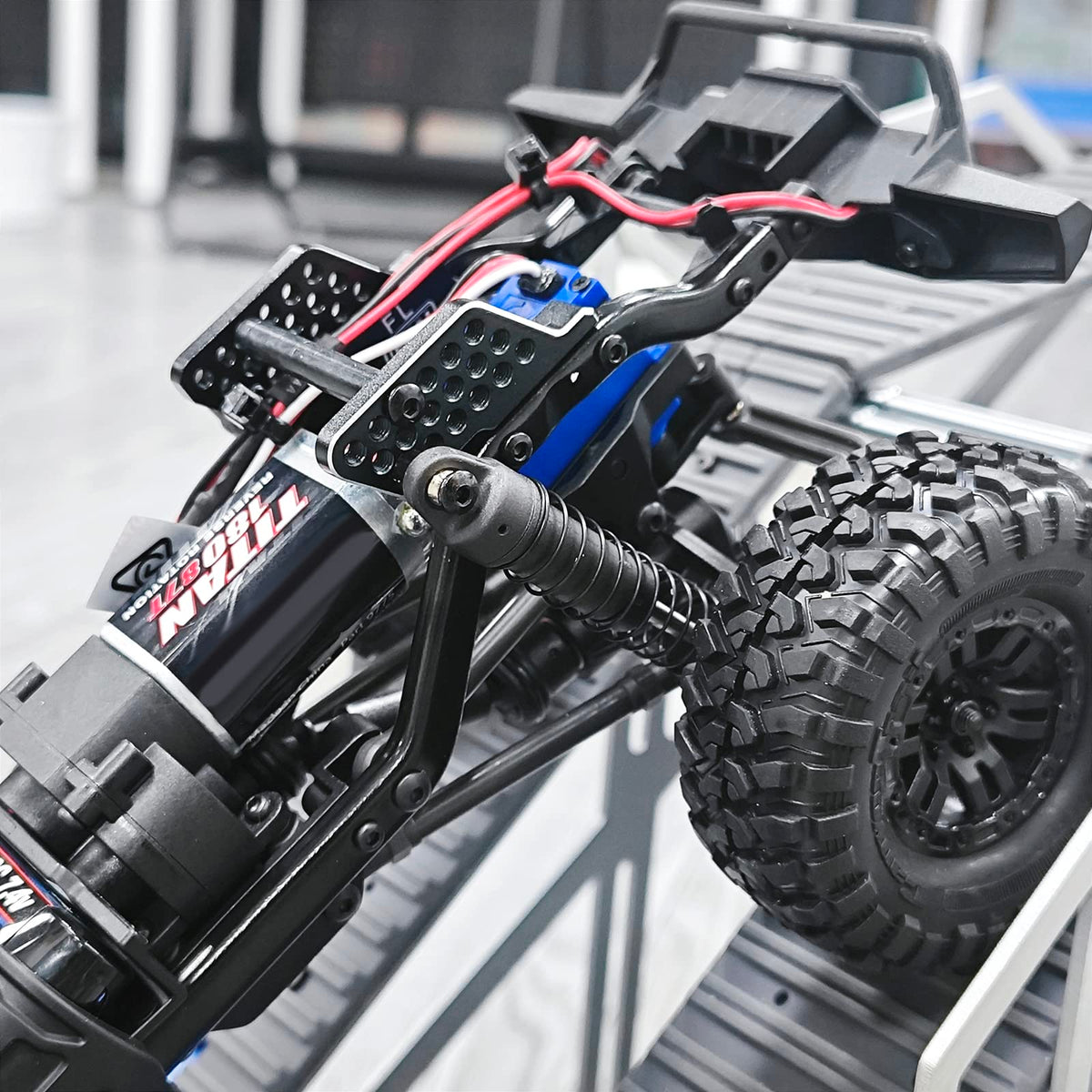 Rugged INJORA mount enhances look and performance on axial crawlers.
