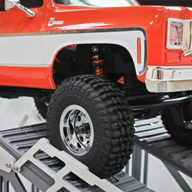 Close-up of gold finish on INJORA shocks matching upgrades.