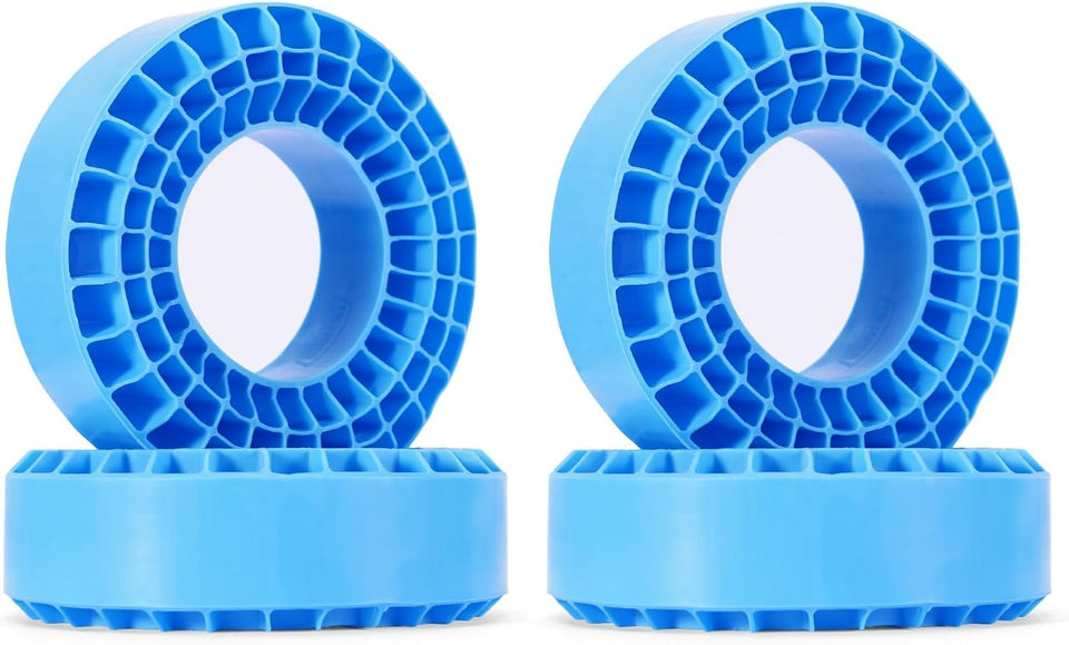 INJORA blue silicone inserts for 106-108mm tires improve stability.