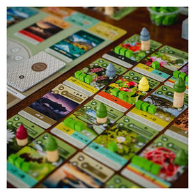 Inside Up Games Earth tableau growth on a 4x4 island