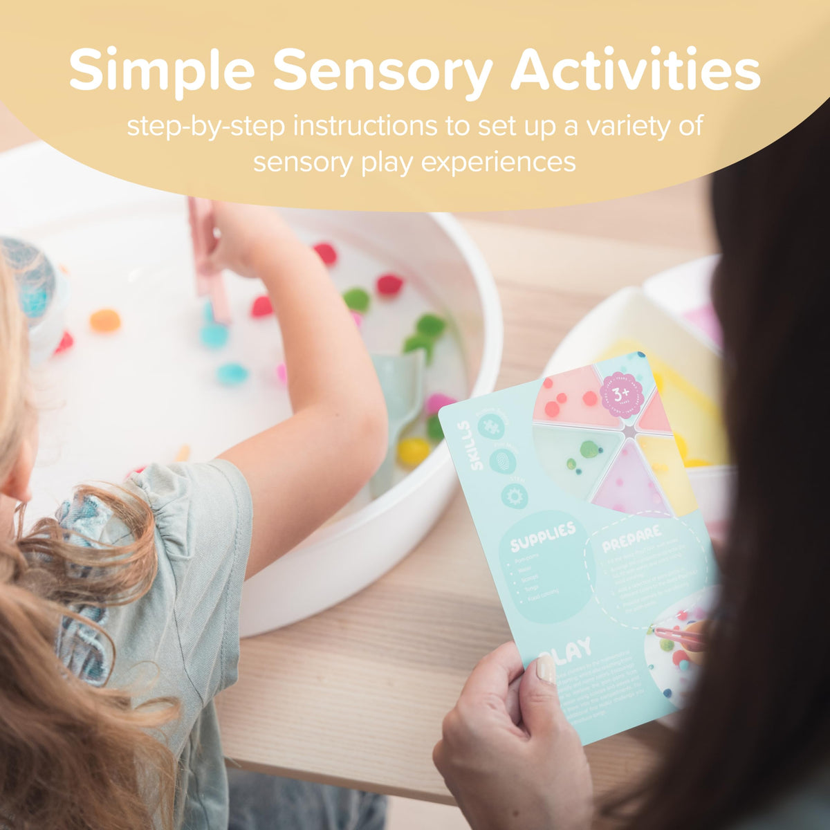 A child uses Inspire My Play sensory cards to explore textures and colors