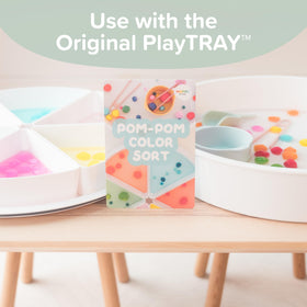 Parents guiding toddler with Inspire My Play sensory cards during playtime