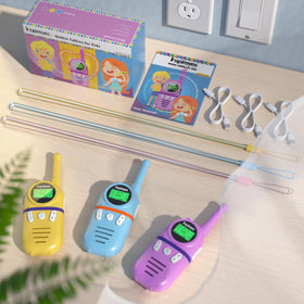 Family using Inspireyes walkie talkies indoors and outdoors for coordinated adventures.