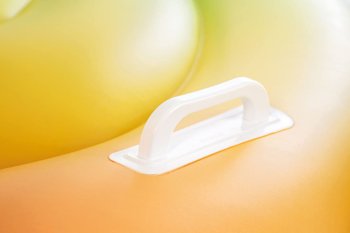 Child rides the Intex Baby Duck pool float during water play