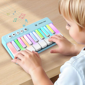 iPlay iLearn mini piano with rainbow lights for on-the-go music play.