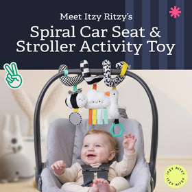 Itzy Ritzy Spiral Toy mirror reflects light for visual engagement during travels