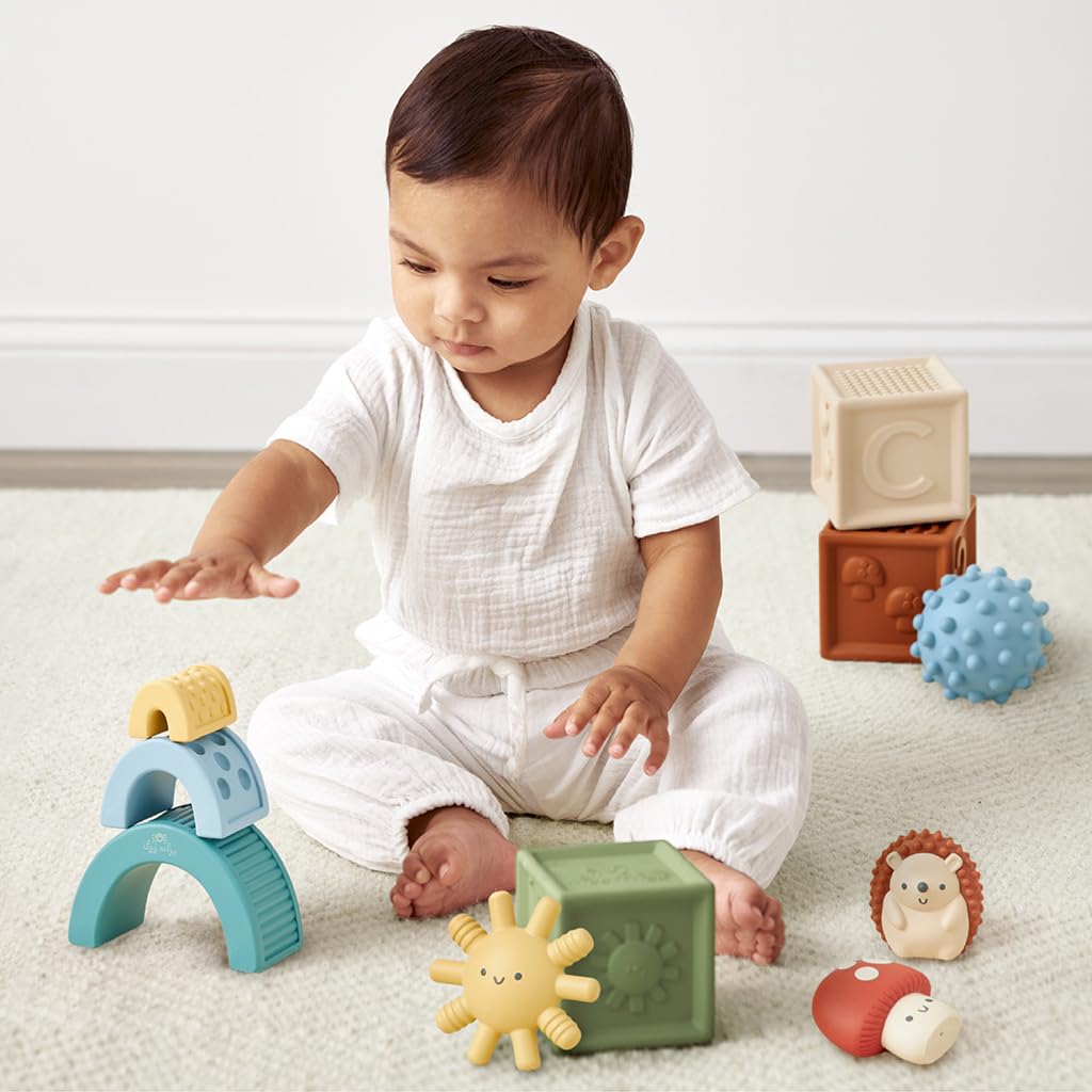 Itzy Ritzy textured blocks and characters invite stacking, squeezing, and imaginative storytelling.