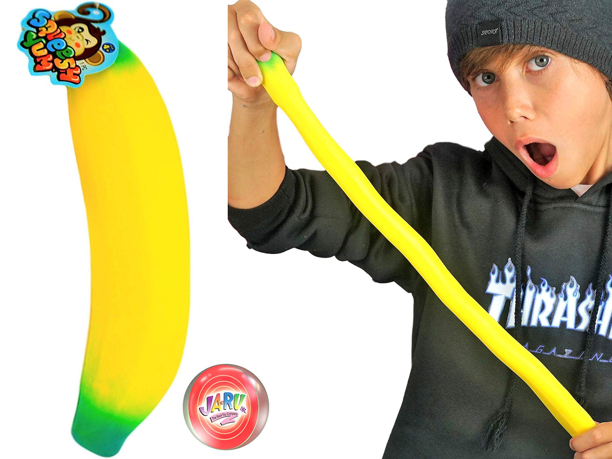 JA-RU banana squishy stretched to illustrate flexibility and play.