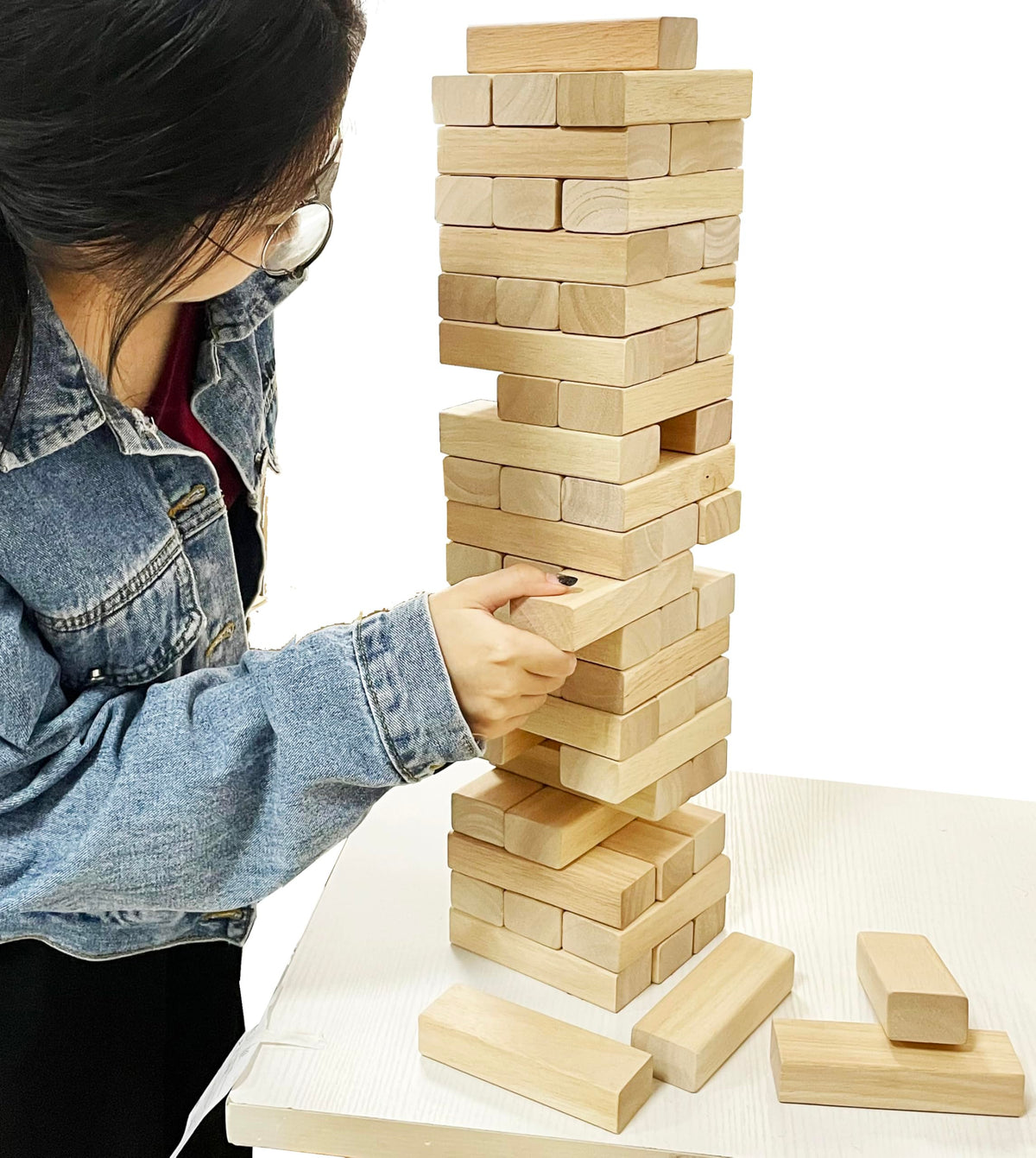 Two players stack as the tower rises from 1.5 ft to 2.6 ft.