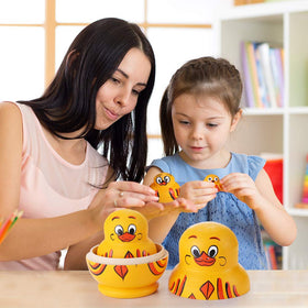 JACE 10-piece yellow duck nesting dolls top stack showing artisanal craftsmanship