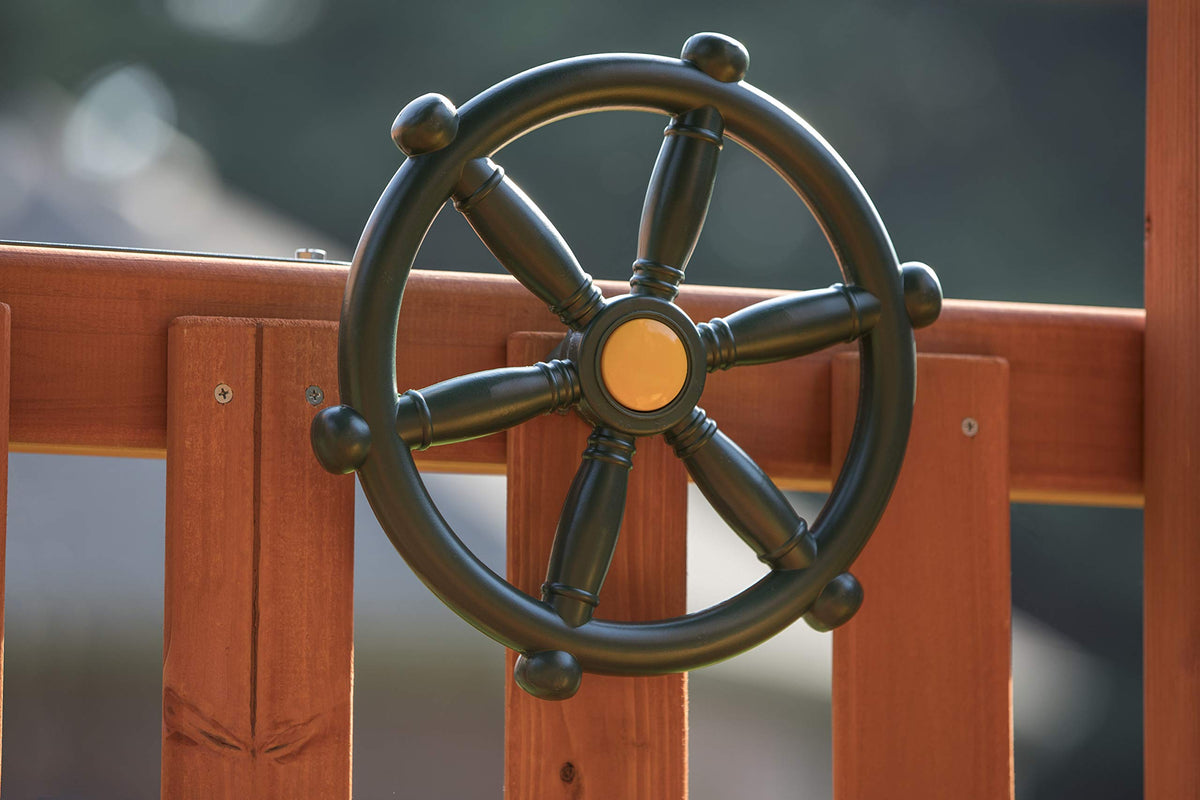 Jack and June Captain Ship Wheel on backyard playset inspires nautical adventures.