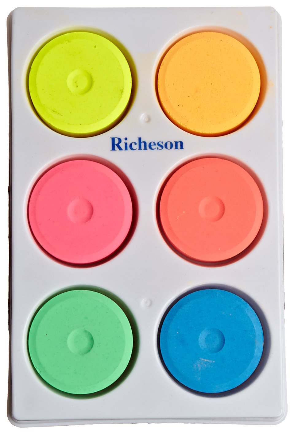 Jack Richeson tempera paint cakes with fluorescent colors in a tray for classroom use.