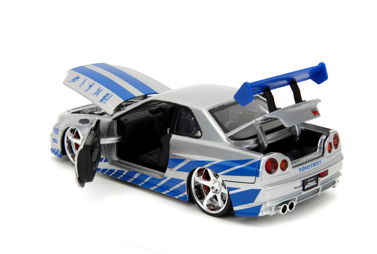 Interior detail of Jada Nissan Skyline R34 1:24 shows cockpit and seats.