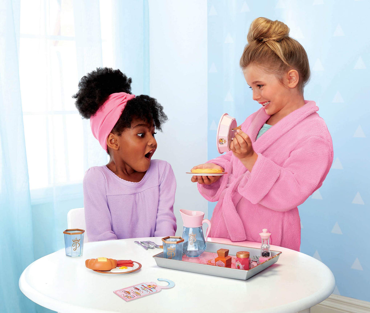 Disney Princess plate cover lifting to reveal a pretend meal during play.