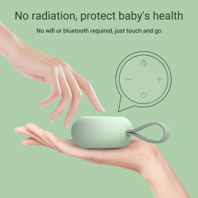 Peaceful sleeping baby with mint device nearby, ideal for home and travel.