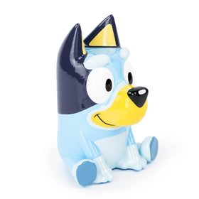 Jay Franco Bluey ceramic piggy bank in a cozy kid’s space.