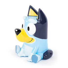 Jay Franco Bluey piggy bank with coins inside.