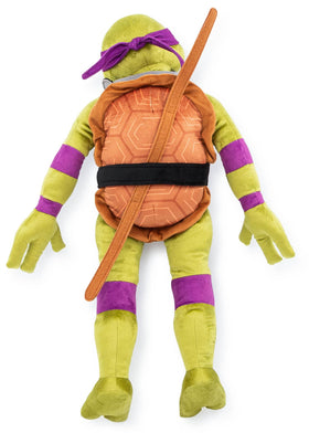 Donatello plush pillow on car ride adds soft comfort during travel.