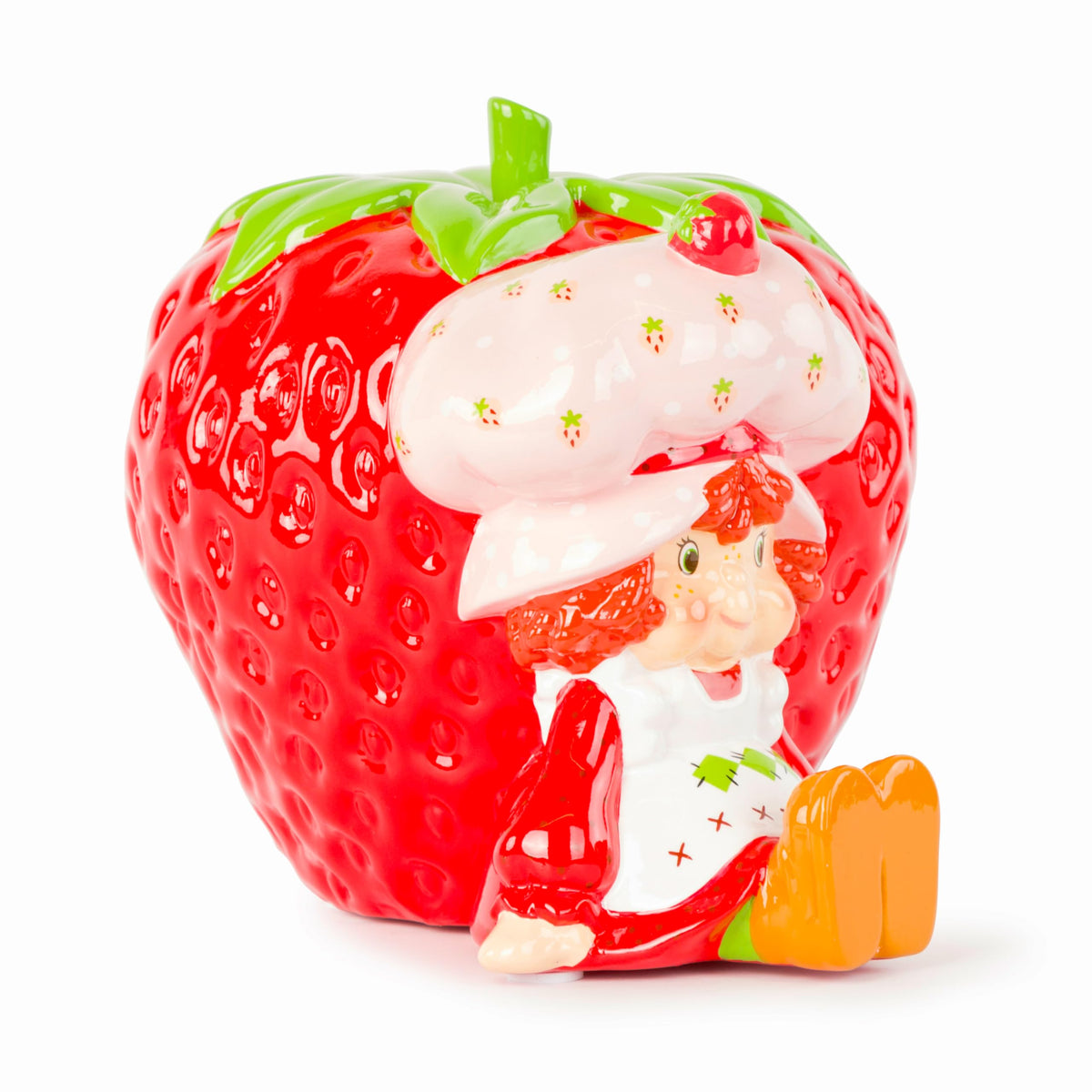 Jay Franco Strawberry Shortcake piggy bank on a desk decor reflects durable ceramic craftsmanship.