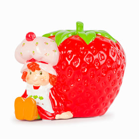 Jay Franco Strawberry Shortcake piggy bank side view shown on a shelf encourages daily saving habits.