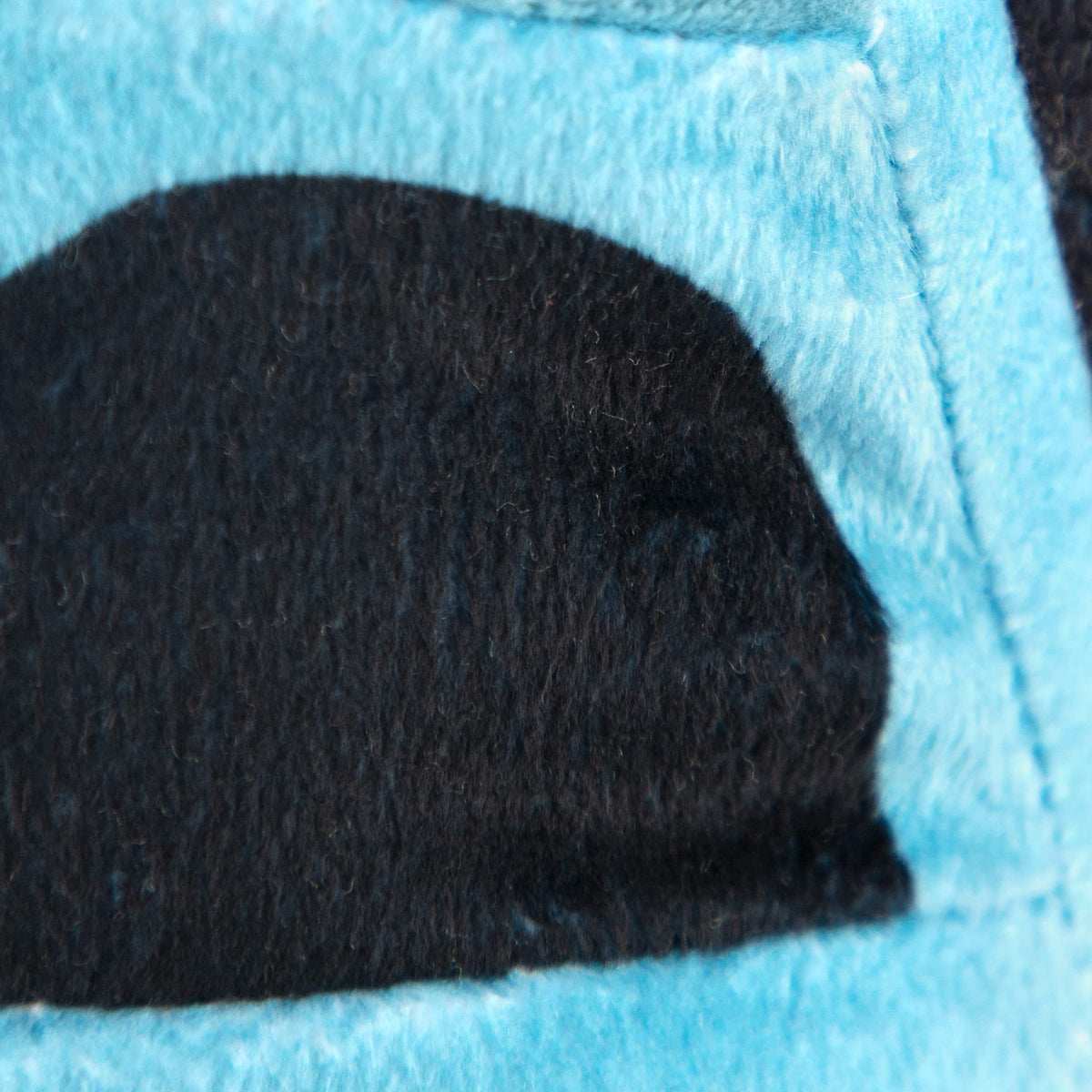 Jay Franco Monster Jam Megalodon pillow in bed, a sleeping buddy for kids.