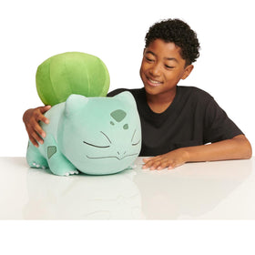 Jazwares Pokémon Bulbasaur sleeping plush in an 18-inch pose for cuddling.