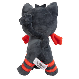 Child hugs Litten plush during playtime for comfort.