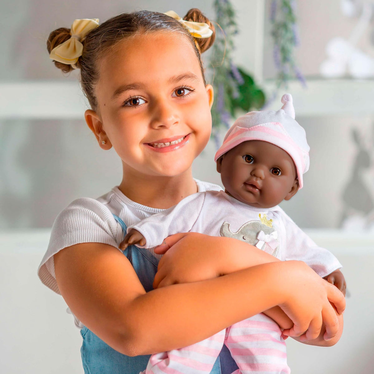 Doll with bottle and pacifier for feeding pretend play moments by JC Toys.