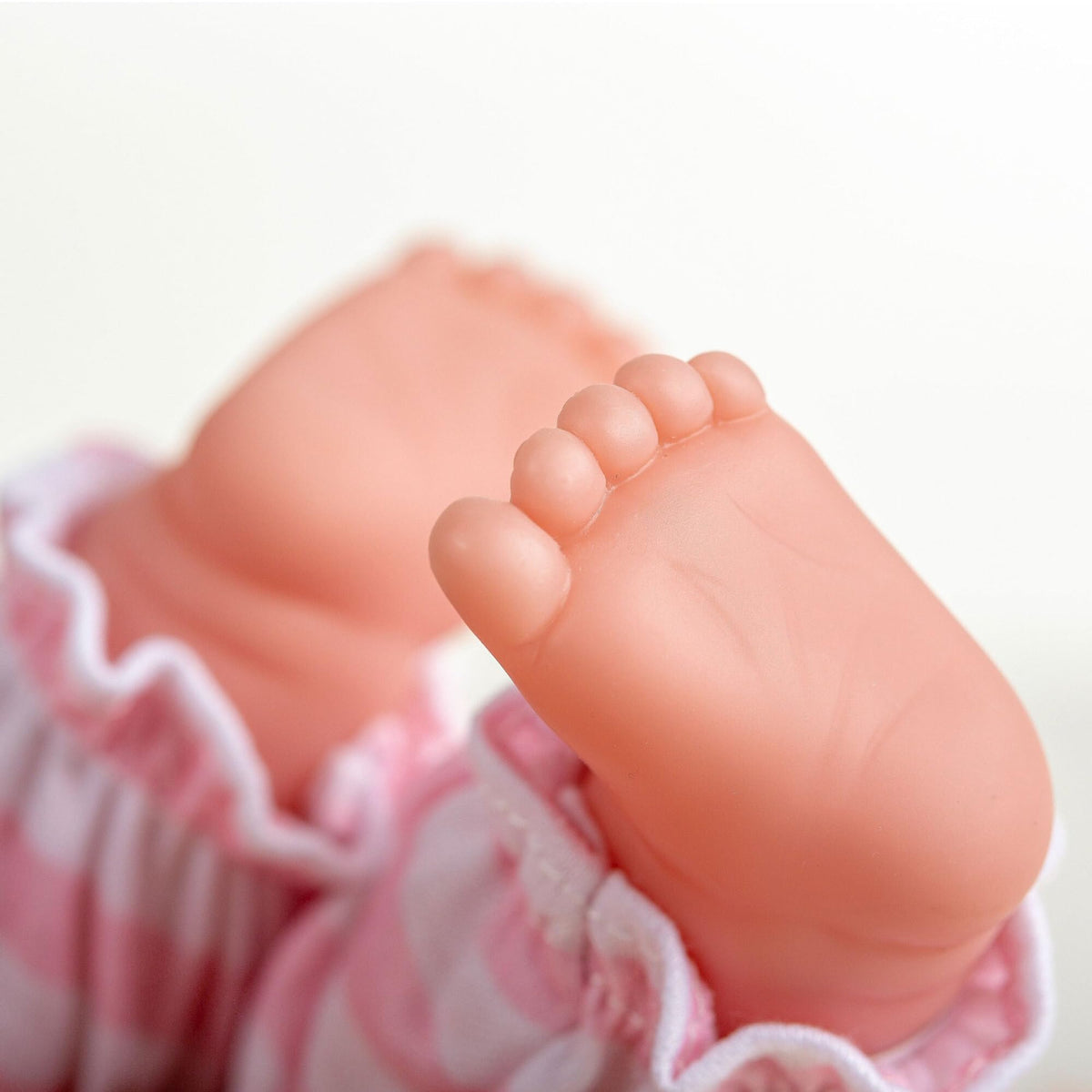 JC Toys Berenguer doll shoes included for finishing outfits.