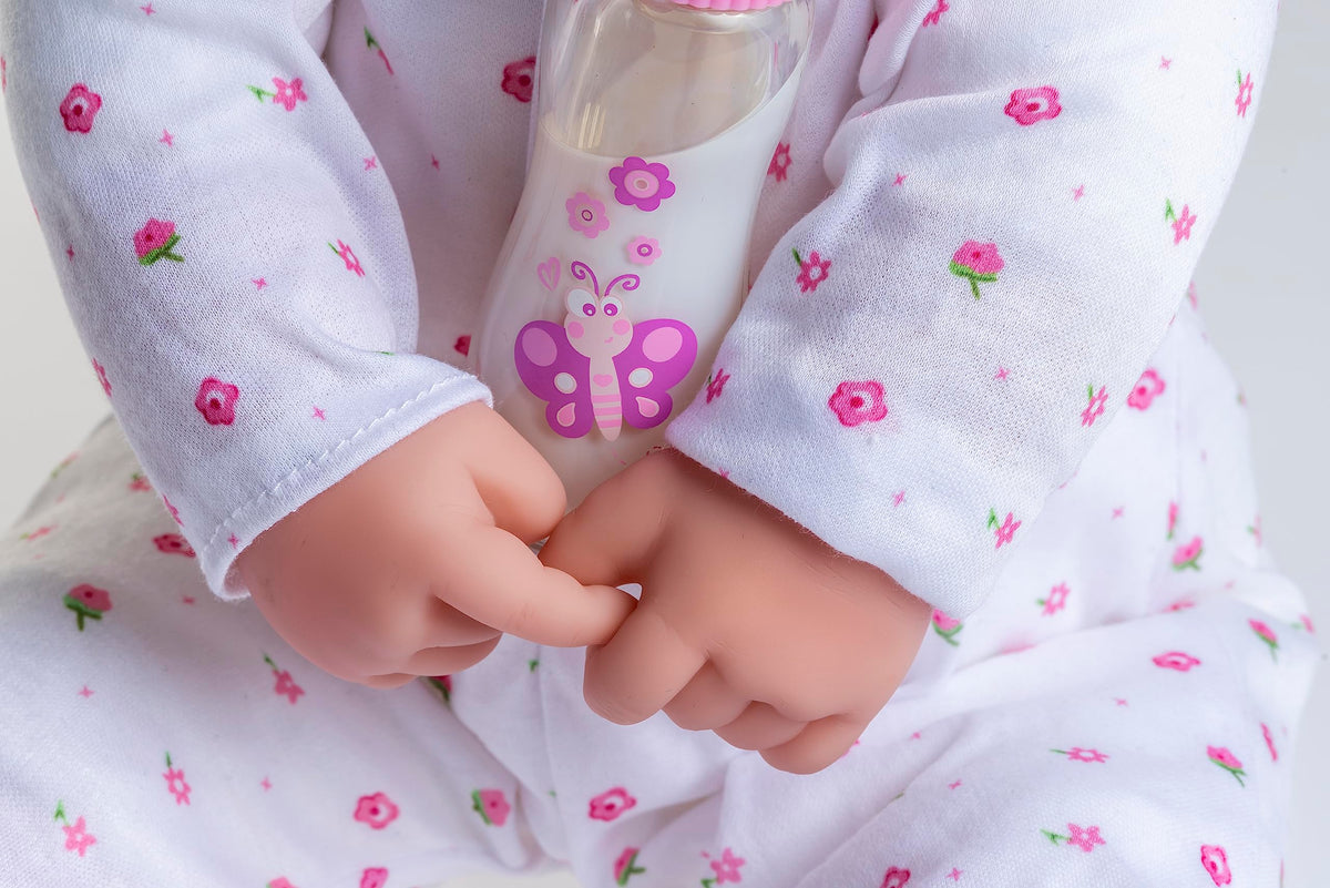 JC Toys La Baby in pink outfit with removable pieces supports easy dressing.
