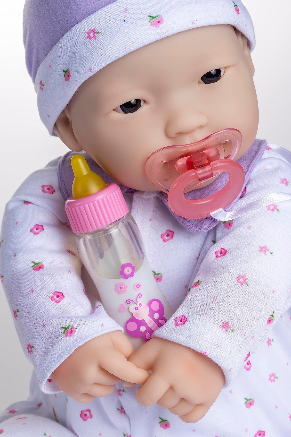 JC Toys La Baby purple sleeper and hat invite easy dressing and cozy daytime naps.