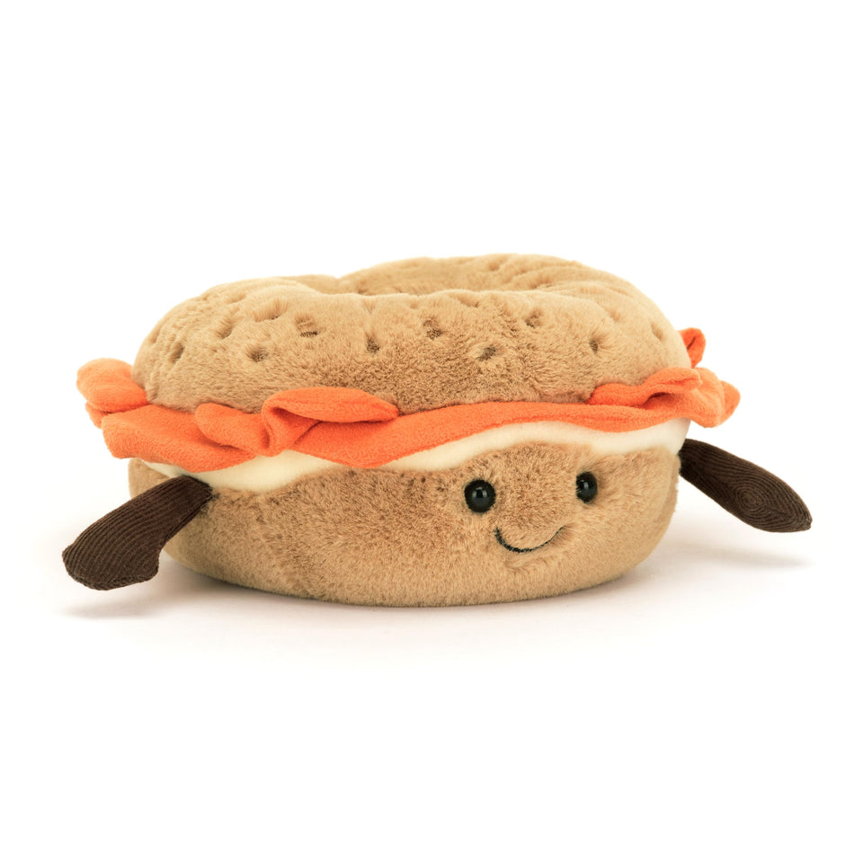 Jellycat Amuseables Bagel Plush front view with sesame freckles adds whimsy to any room