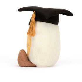 Jellycat Amuseables Boiled Egg Graduate with cotton mortarboard; playful classroom vibes.