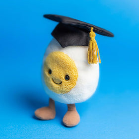 Jellycat Amuseables Boiled Egg Graduate measures 5.5 x 3.5 x 1.6 inches; compact desk companion.
