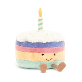 Jellycat Amuseables Rainbow Birthday Cake with color-layered blocks in pink, purple, yellow, and green.