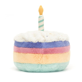 Soft suedette candle on Jellycat Rainbow Birthday Cake plush adds tactile charm.