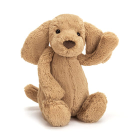 Jellycat Bashful Toffee Puppy snuggle closeup, showcasing soft fur and inviting hugs.
