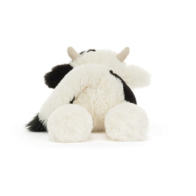 Jellycat Smudge Cow golf cart lean adds relaxed home charm.