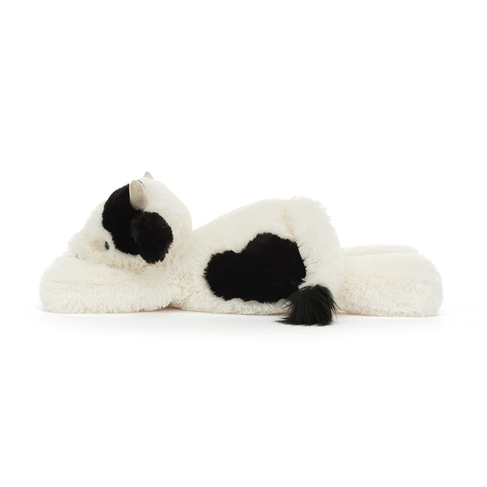 Jellycat Smudge Cow contemplative stare enhances cozy shelf display.