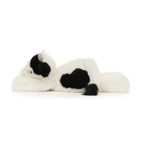 Jellycat Smudge Cow contemplative stare enhances cozy shelf display.