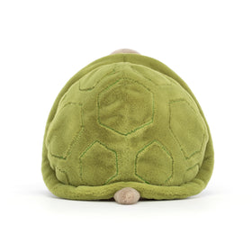 Soft beige fur and moss-green shell invite gentle hugs and play.
